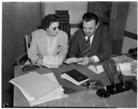 Madam Lee Francis and Judge Cecil D. Holland reading an anonymous letter that was sent to the Judge, Los Angeles, 1940