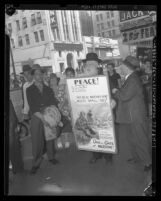 Rabbi Moses J. Bergman carrying poster reading "Open the Gate of Palestine" outside the consulate, Los Angeles, 1945