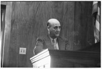 Los Angelest Dist. Attorney's office investigator, Lloyd Yarrow, testifies in court, July 30, 1937