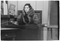 Actress Bebe Daniels on the witness stand during a trial for Albert F. Holland, who wrote 150 love letters to Daniels, Los Angeles, 1933