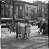 Woman talking to a group of truant girls in downtown Los Angeles, March 1946