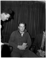 Reporters interview convicted bigamist James Pershing Willis, Los Angeles, 1940