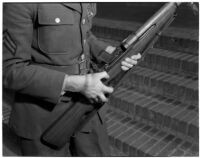 Soldier holding the U.S. Army's new Garand rifle, on display as part of National Defense week, Los Angeles, February 1940