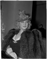 Mae West in court during questioning about earnings from her role in the movie "She Done Him Wrong," Los Angeles, 1940