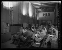 Doctors at an American Medical Association convention watching Dick Russell's televised heart surgery in Los Angeles, Calif., 1951