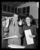 U.S. Senator and Vice-Presidential candidate Richard M. Nixon and wife Patricia making "V" signs with fingers, Calif., 1952