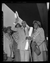 James Francis Marion Jones, (aka Prophet Divine) of Detroit with supporters at Los Angeles Union Station, Calif., 1952