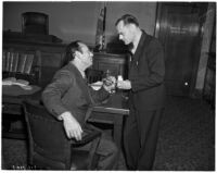 Attorney A. Brigham Rose and grand jury member Clifford E. Clinton facing charges of contempt, Los Angeles, December 1937