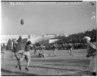 Players battle for the ball during a football game between Franklin and Roosevelt High Schools, Los Angeles, October 8, 1937