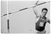 USC high jumper in mid-leap at a track meet, Los Angeles, 1937 — Calisphere