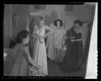 Four models dressing for Los Angeles, Calif.'s 1941 Spring Fashion show