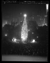 Tree lighting ceremony for 105-foot Christmas tree in Pershing Square, Los Angeles, Calif., 1949