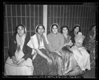 Six Gypsy women sitting in jail cell in Los Angeles, Calif., 1940