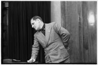 Ambulance driver Harry T. Meredith takes the witness stand during the murder trial of Paul A. Wright, Los Angeles, 1938