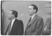 Murder suspect Robert S. James standing between two unidentified men in court, Los Angeles, 1936