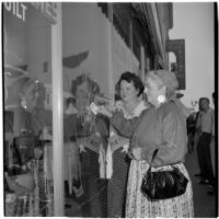 Mrs. Monte Webb and Mrs. W. R. Reinhart window shopping during Anaheim's annual Halloween festival, Anaheim, October 31, 1946