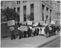 Pickets from the Workers Alliance protesting outside the State Building during S.R.A. hearings, Los Angeles, March 5, 1940