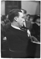 Widower Robert S. James sitting in a courtroom during an inquest involving his wife's death, Los Angeles, 1935