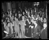 Reverend Joseph Jeffers and wife Zella of Kingdom Temple, with followers after being released on bail in Los Angeles, Calif., 1939