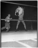 Wrestler Dean Detton about to slam his opponent Kiman Kudo into the mat at Olympic Auditorium, Los Angeles, August 25, 1937