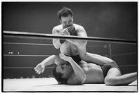 Wrestling match between Italian newcomer Vincent Austeri and Salt Lake City native Del Kunkel at Olympic Auditorium, Los Angeles, 1938