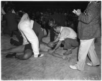 Wrestler Vincent López after being body slammed by Bronko Nagurski during a match at Wrigley Field, Los Angeles, 1937