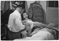 Boxer Bob Nestell getting his hand taped up before a fight, Los Angeles, 1937