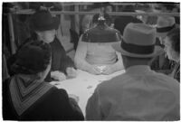 Patrons playing cards in a casino, Los Angeles, 1937