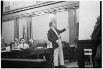 Public defender Ellery Cuff indicating a point on a map at his client Albert Dyer's murder trial, Los Angeles, 1937