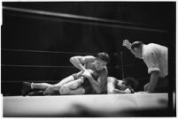 Heavyweight wrestler Vincent López grappling with newcomer El Pulpo at the Olympic, Los Angeles, 1937