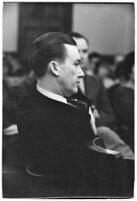 Widower Robert S. James sitting in a courtroom during an inquest involving his wife's death, Los Angeles, 1935