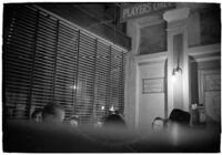 Patrons playing cards in a casino, Los Angeles, 1937