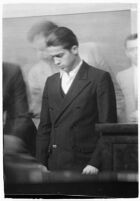 Louis Rude Payne at an inquest for the murder of his mother and younger brother, Los Angeles, June 6, 1934