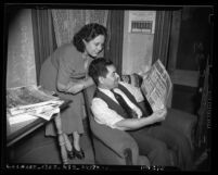 Antonio and Gladys Medrano reading Spanish language newspaper "La Opinion" in Los Angeles, Calif., 1940