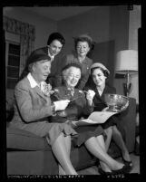 Five women inspecting items for St. Alban's Episcopal Church charity fair in Los Angeles, Calif., 1954