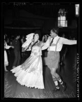 Daphne Alley in Mexican costume and R. Allen Pelton in Bavarian costume dancing at Folk Dance Festival in Los Angeles, Calif., 1949