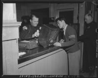 Japanese submit personal property to the Los Angeles Police Department, California, 1942