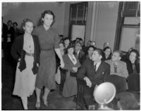 Deputy Sheriff Bess Bailey escorts Betty Flay Hardaker during her trial for the murder of her daughter, Los Angeles, 1940