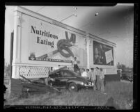 Automobile crash into billboard on Wilshire Blvd. and Mansfield Street in Los Angeles, circa 1942