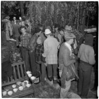 Boy Scout Troop 47 drinking hot chocolate after being marooned overnight in the Arroyo Seco Canyon, Los Angeles, December 9, 1946