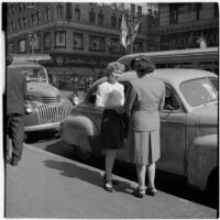 Woman talking to a truant girl in downtown Los Angeles, March 1946