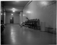 Shirley Smith waits in the hall while Superior Judge Fred Miller decides on a home for her after her divorced parents declare they do not want custody, Los Angeles, 1947