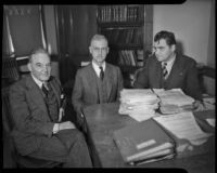Maj. Donald H. Connolly, C.W.A. director of Los Angeles County, meets with Peirson M. Hall and Capt. Edward Macauley, circa February 1934
