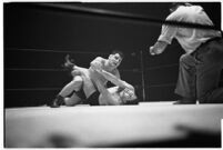 Heavyweight champion Dean Detton wrestling an opponent at the Olympic Auditorium, Los Angeles, 1937