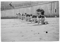 Track athletes poised to race at a meet between UCLA and USC, Los Angeles, 1937