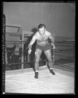 Wrestler and football player Bronko Nagurski posing in ring, circa 1937