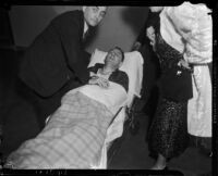 District Attorney Buron Fitts on a stretcher after being shot, Los Angeles, 1937