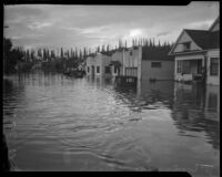 Homes and vehicles submerged in flood waters, Long Beach, 1930s