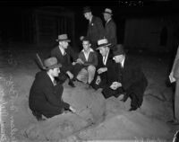 Former Marine Nelson D. Boyer showing police the place where he buried his wife's body after murdering her, South Gate, October 26, 1937