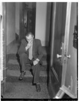 Charles H. Hope sitting outside of court for his joint murder trial with Robert S. James, Los Angeles, 1936